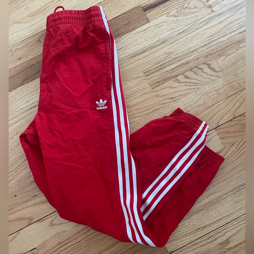 Red adidas track pants
